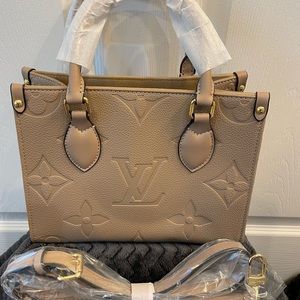 1:1 tan small Louis Vuitton purse (not authentic but great quality)